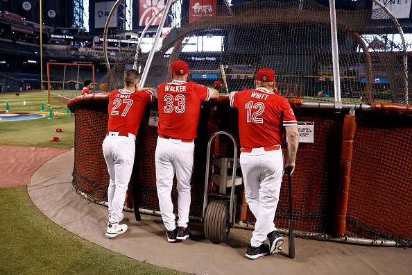 Team Canada coaches look on as their team takes batting practice before facing Team Great Britain in the World Baseball Classic.