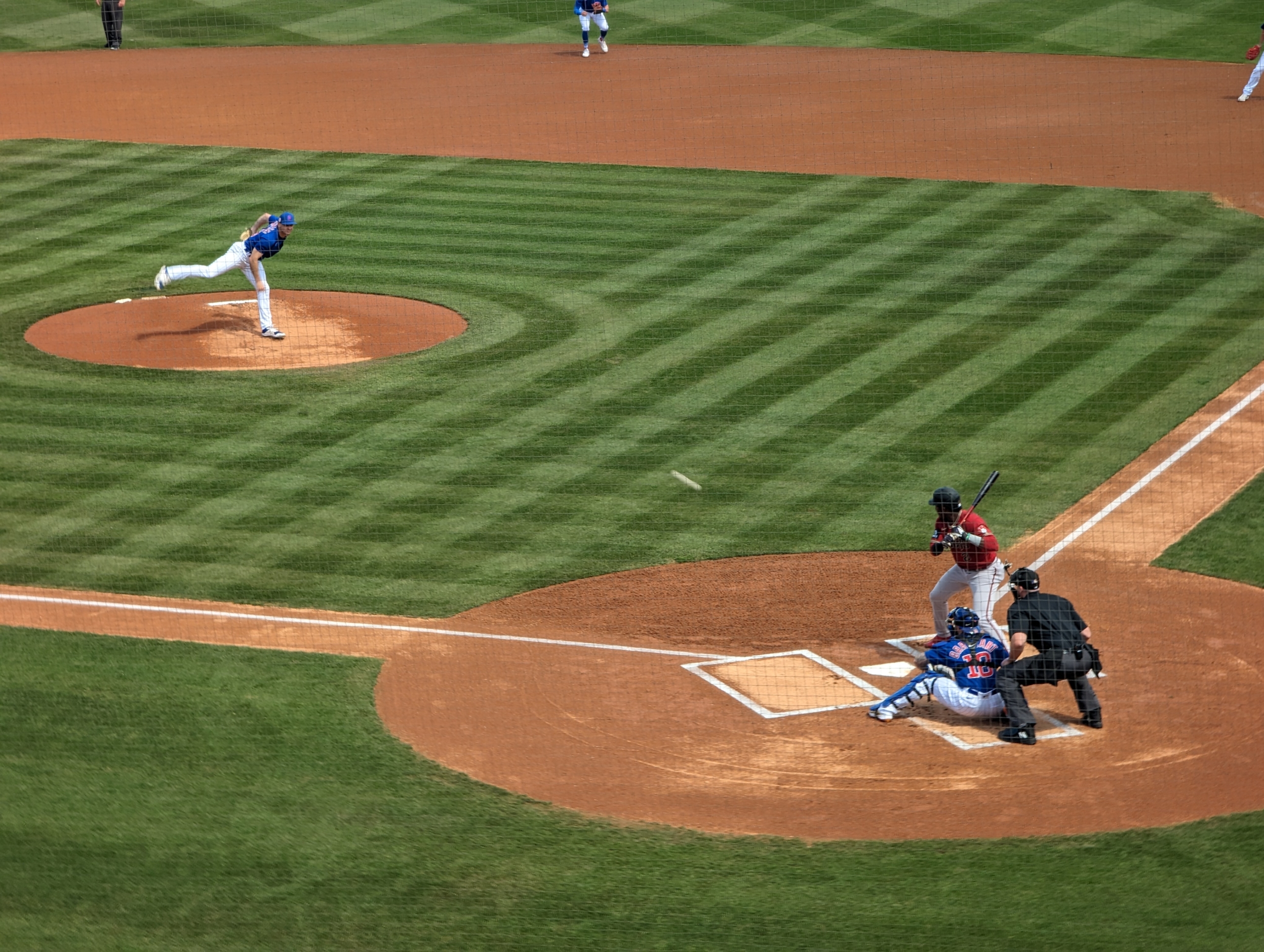 Hayden Wesneski delivering a pitch to Geraldo Perdomo in the Cactus League game between the Cubs and Diamondbacks