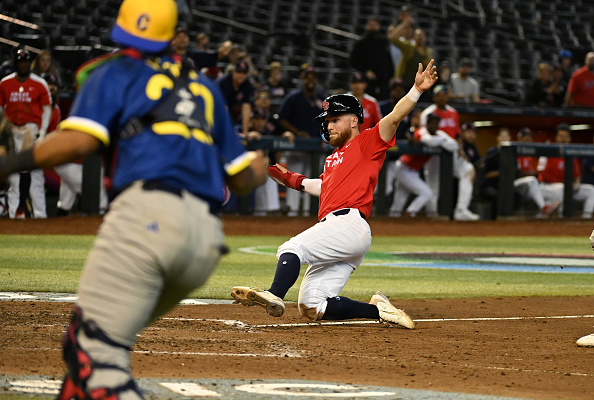 Nick Ward sliding into home in the Great Britain win over Colombia