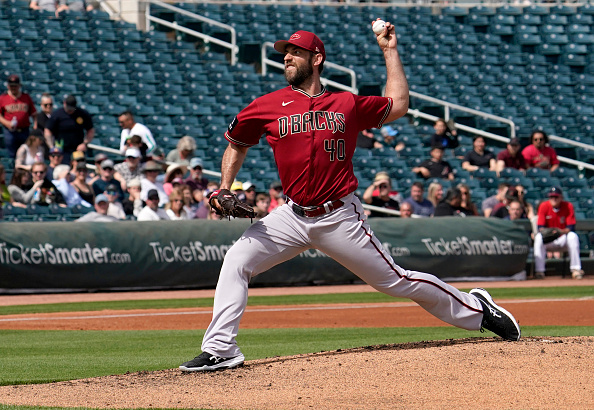 Madison Bumgarner throws a pitch in Cactus League play against the Cleveland Guardians