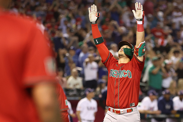 Joey Meneses celebrates a homer in the 11–5 Mexico victory over USA in the World Baseball Classic.