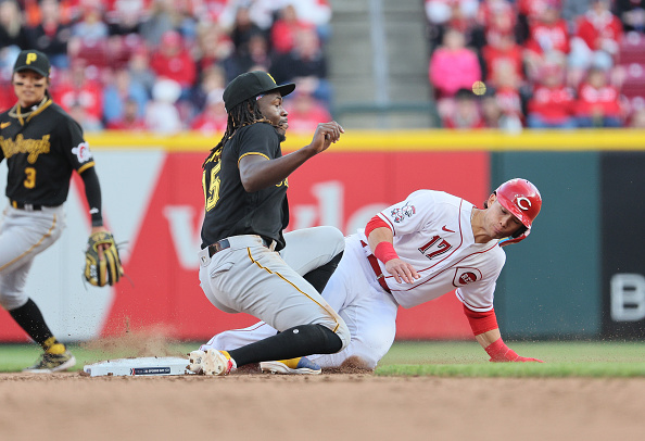 Stuart Fairchild of the Reds gets tagged out by O'Neil Cruz of the Pirates