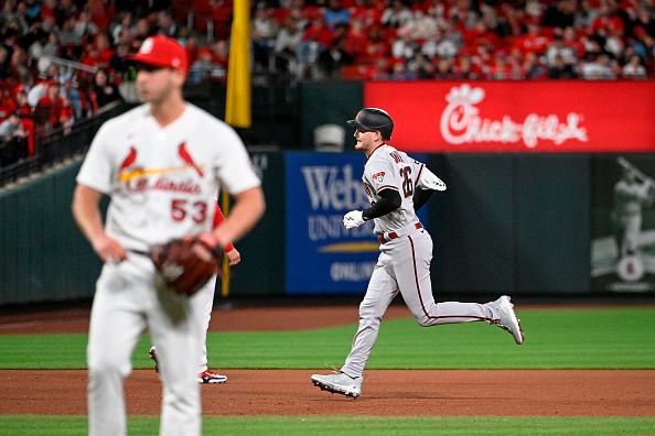 Pavin Smith of the Diamondbacks rounds the bases after hitting a grand slam against the Cardinals.