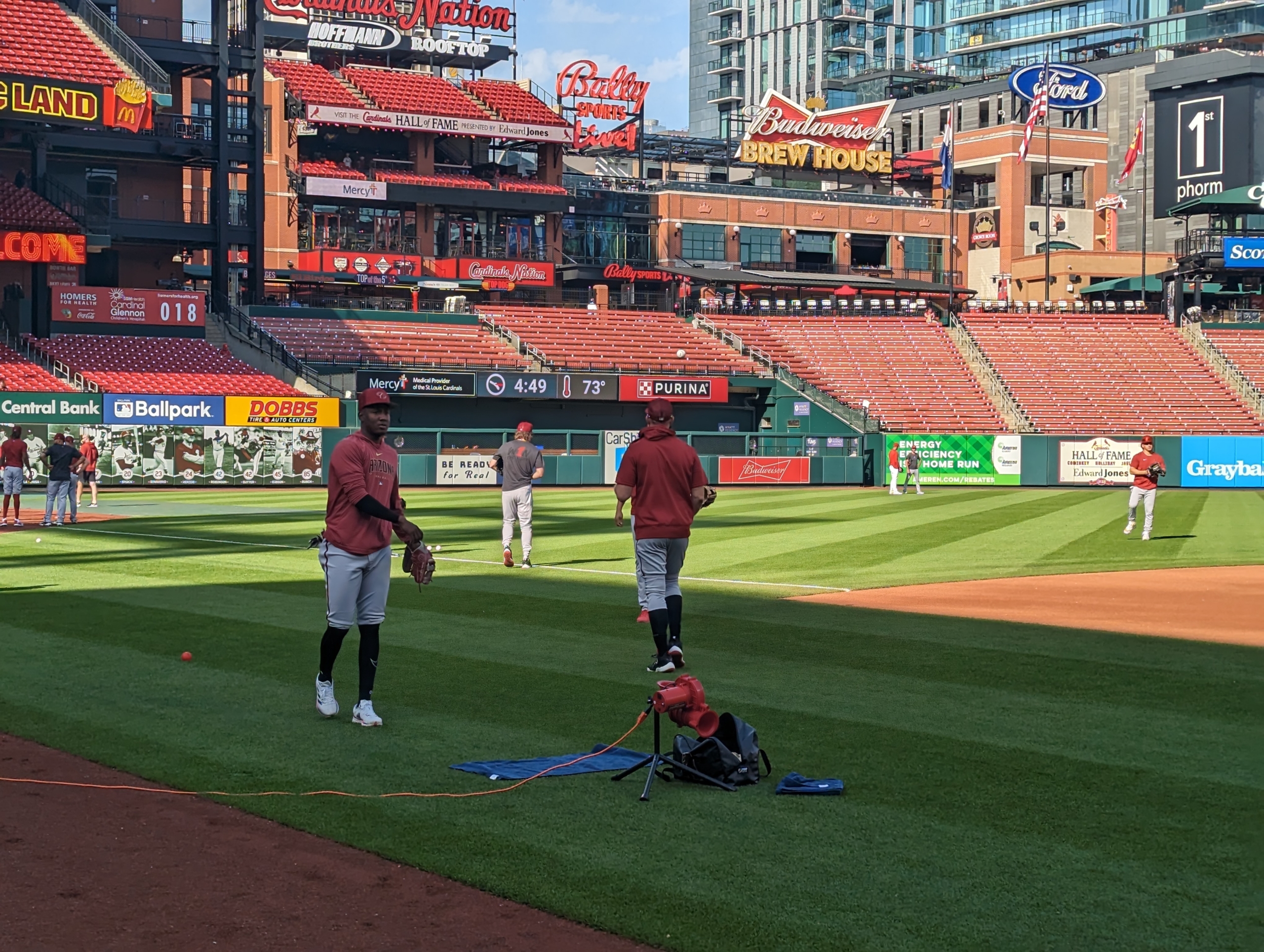 Diamondbacks players warm up prior to their game against the Cardinals