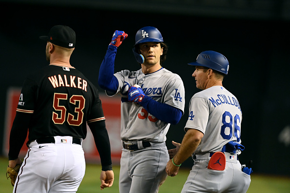 James Outman of the Dodgers signals to the dugout after an RBI single against the Diamondbacks