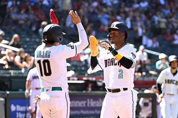 Josh Rojas and Geraldo Perdomo exchanging high-fives in the Diamondbacks victory over the Dodgers