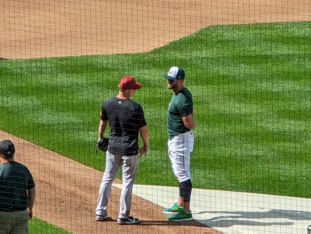 One player each from the Diamondbacks and Rockies chatting before the game