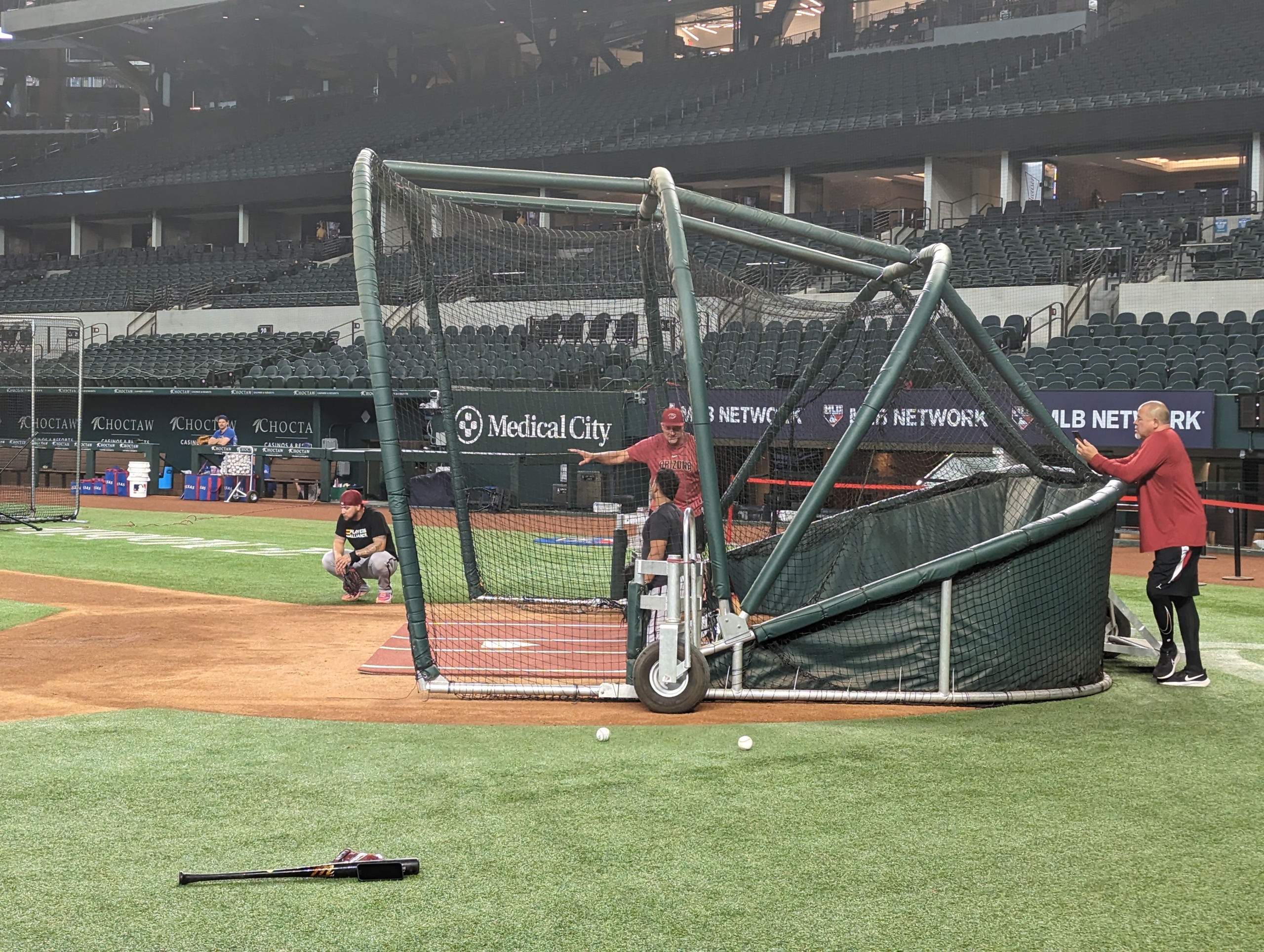 Diamondbacks catchers taking instruction before their game with the Rangers.