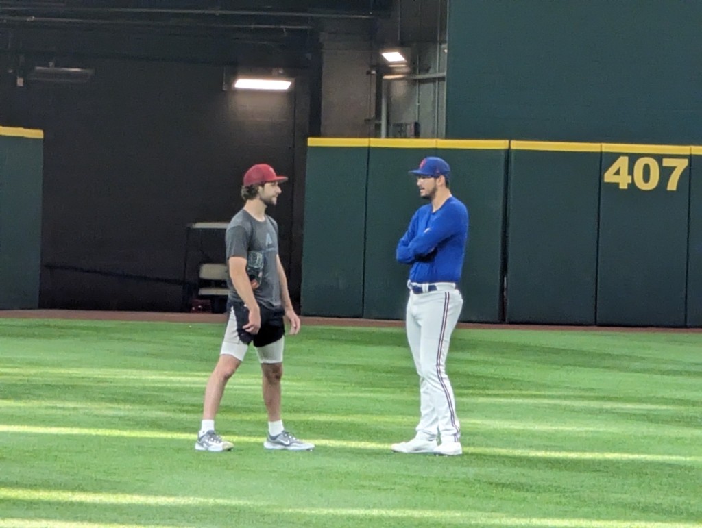 Zac Gallen of the Diamondbacks chatting with Dane Dunning of the Rangers.