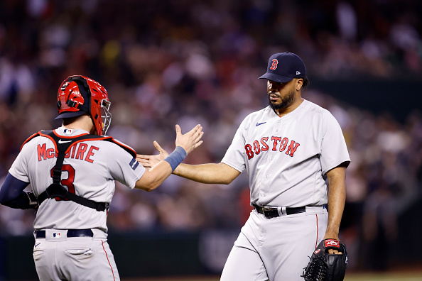 Kenley Jansen of the Red Sox celebrates a 2–1 victory over the Diamondbacks with his catcher, Reese McGuire.
