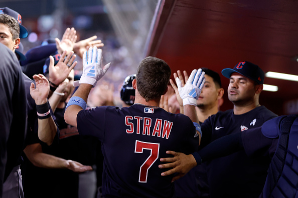 Myles Straw of the Cleveland Guardians celebrates with teammates during a 12–3 rout of the Arizona Diamondbacks.