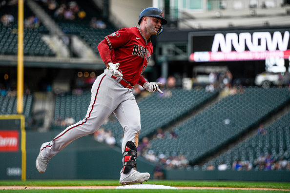 Christian Walker of the Diamondbacks rounding the bases after hitting the go-ahead homer against the Rockies