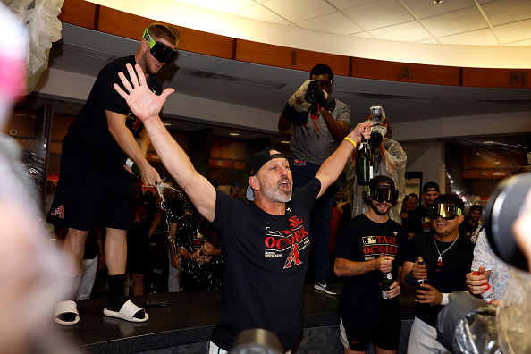 Diamondbacks celebrate after clinching the playoffs despite losing to the Astros