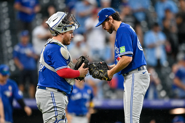 Jordan Romano celebrating with Alejandro Kirk. Their Toronto Blue Jays are second in the AL and third overall in Week 23's bullpen/reliever/relief corps rankings