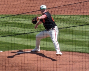 Logan Webb of the Giants throwing a pitch in a Cactus League game against the Rockies.