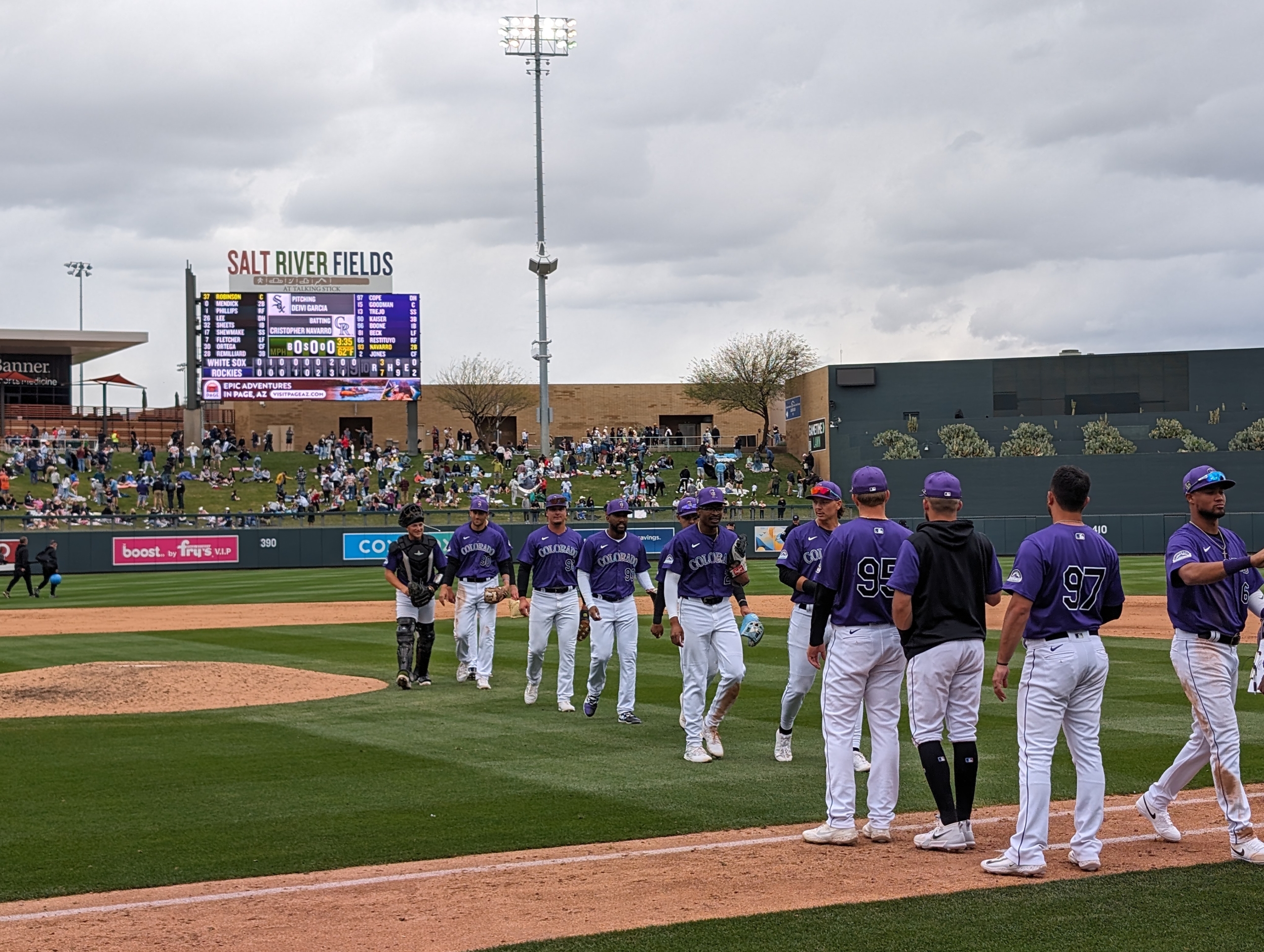 Rockies players celebrating a spring training victory over the White Sox