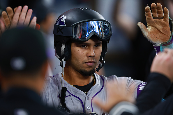 Ezequiel Tovar of the Rockies celebrating a home run against the Blue Jays