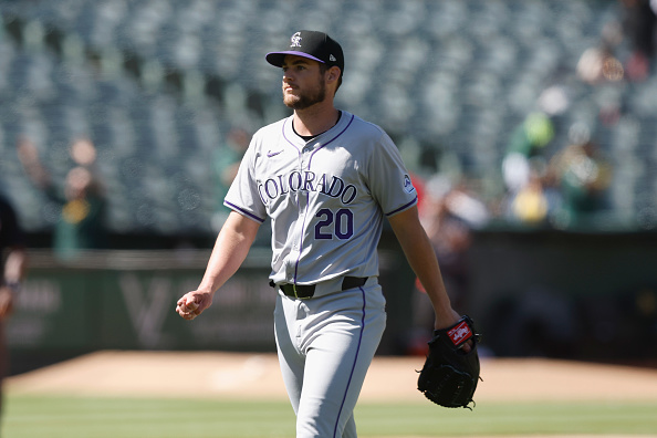 A disappointed Peter Lambert of the Rockies leaves the field after walking in the winning run against the Athletics