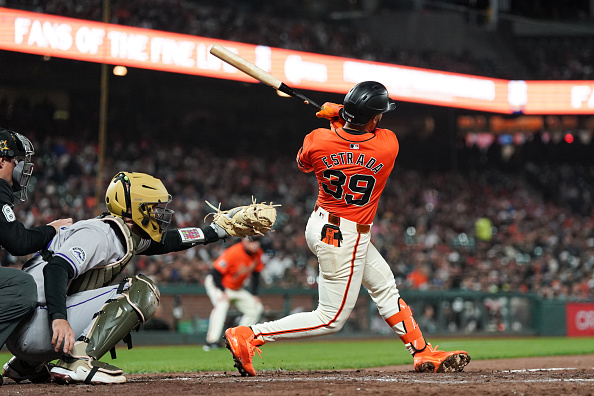 Thairo Estrada of the Giants hitting a home run against the Rockies