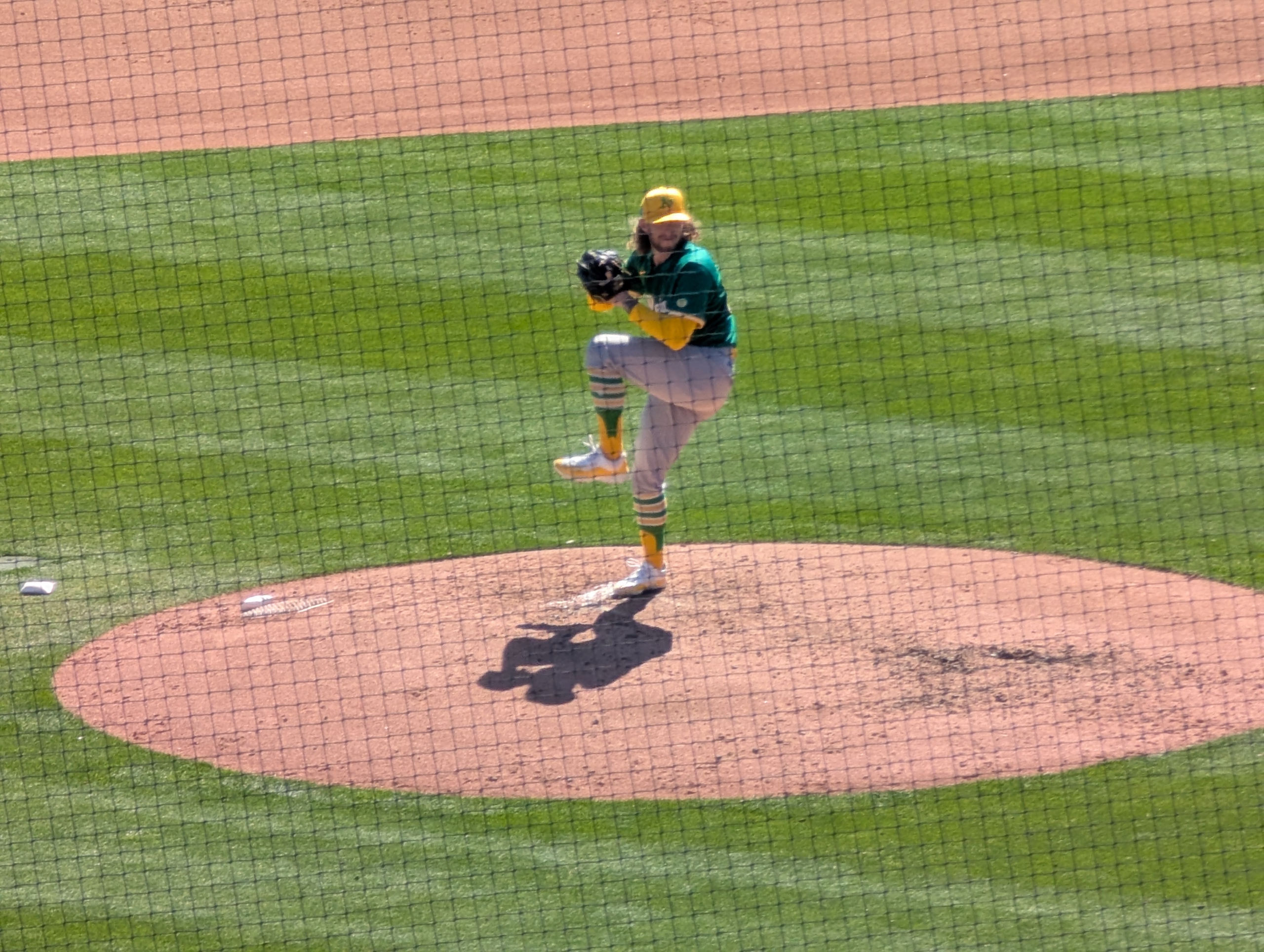 Joey Estes of the Athletics warming up before the fourth inning against the Dodgers