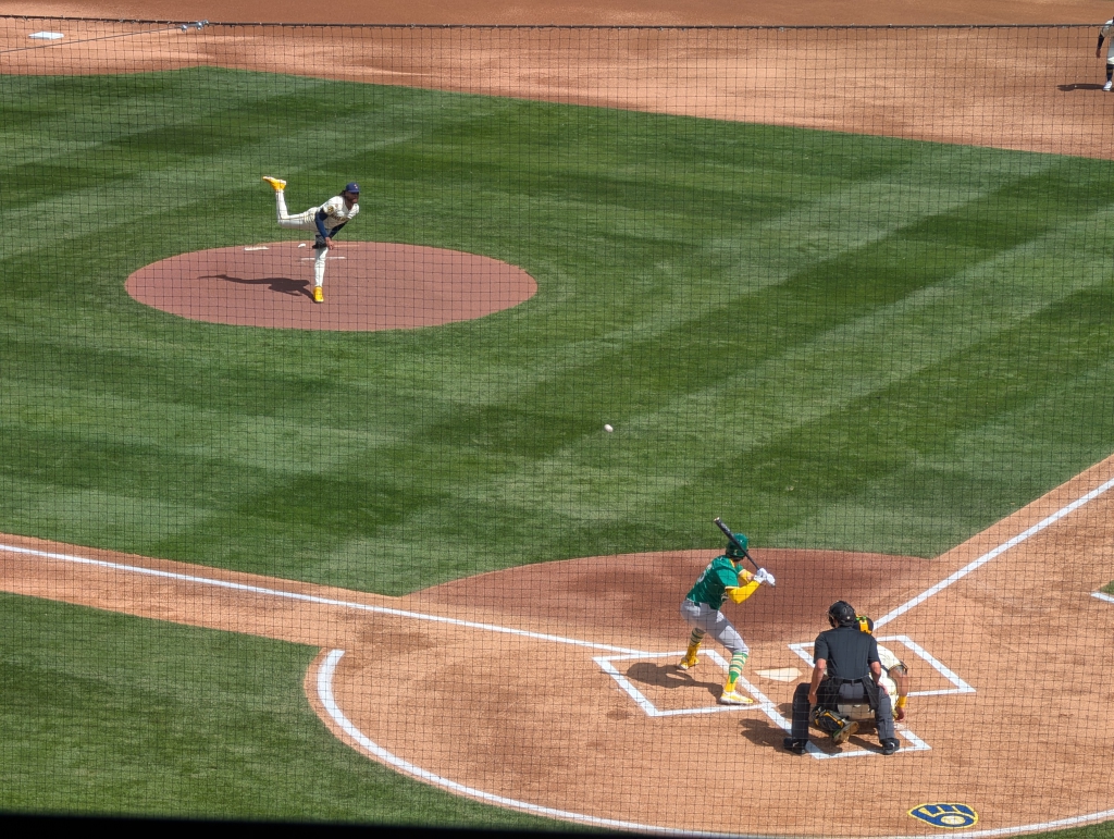 Freddy Peralta of the Brewers pitching to Jacob Wilson of the Athletics. The Brewers scored 7 runs off Athletics starting pitcher Mitch Spence en route to an 8–0 win.