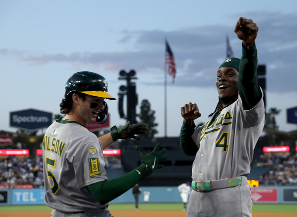 Jacob Wilson and Lawrence Butler of the Athletics celebrate Jacob's homer against the Dodgers