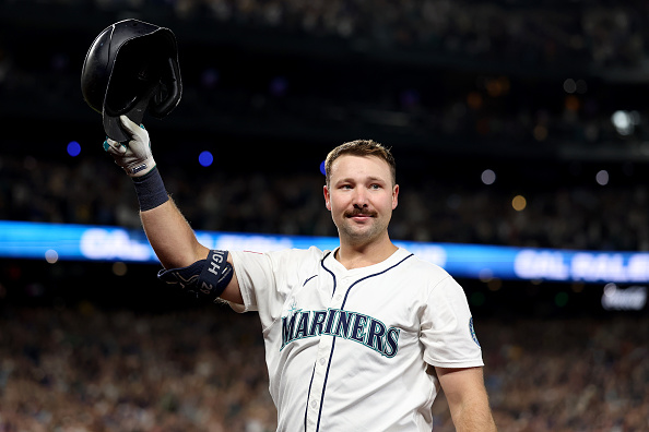 Cal Raleigh tips his hat to the crowd after hitting his 60th home run of the 2025 season