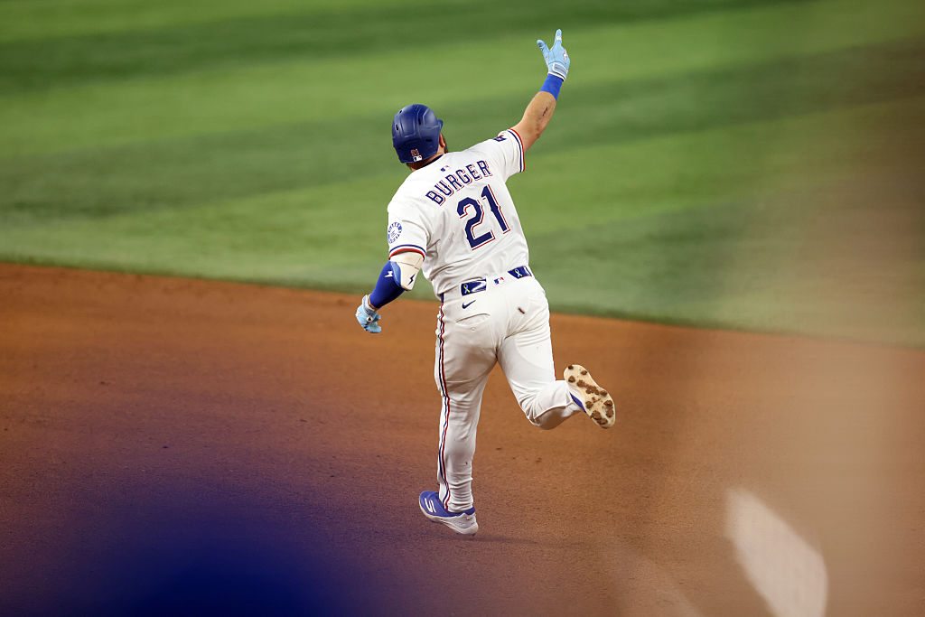 Jake Burger helped the Rangers pull away after Peter Lambert and Nathan Eovaldi traded scoreless innings early.