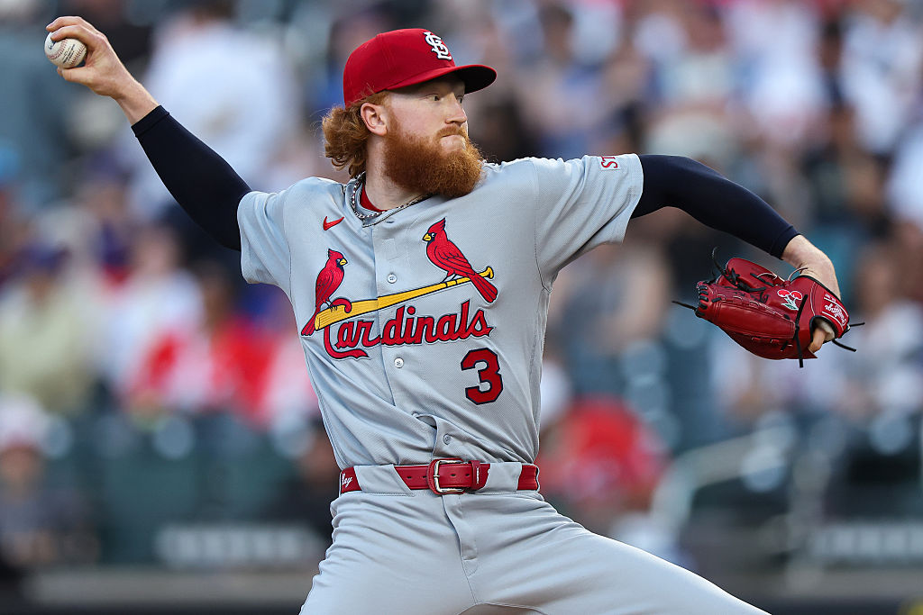 Dustin May of the Cardinals throwing a pitch against the Mets