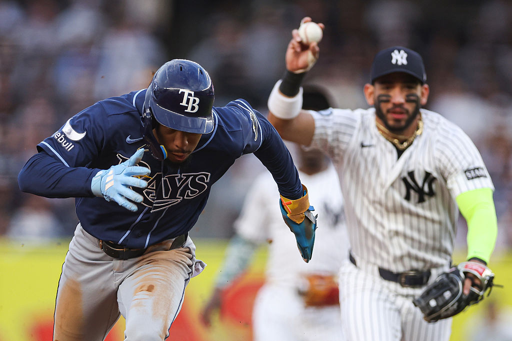 Chandler Simpson of the Rays being chased by Jose Caballero of the Yankees in a rundown