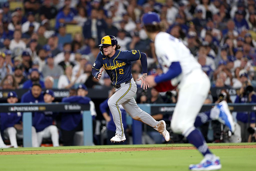 Brice Turang of the Brewers scoring on a wild pitch against the Dodgers in Game Three of the 2026 NLCS