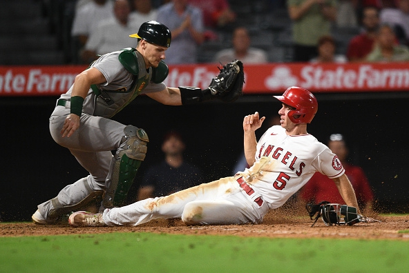 Sean Murphy tags out the sliding Matt Duffy on a play at the plate