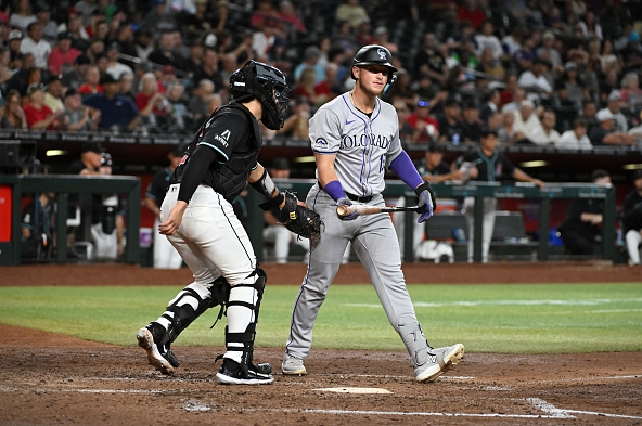 Hunter Goodman of the Rockies reacts after striking out against the Diamondbacks