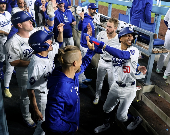 The Dodgers celebrating a run against the Padres