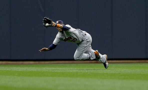 Carlos Gomez making a catch; his trade to the Astros started the most fateful of all baseball trade trees of the 21st century