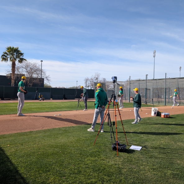 Members of the Athletics Pitching Staff taking bullpen sessions at spring training.