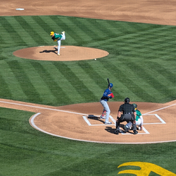 JP Sears of the Athletics pitching to Mookie Betts of the Dodgers