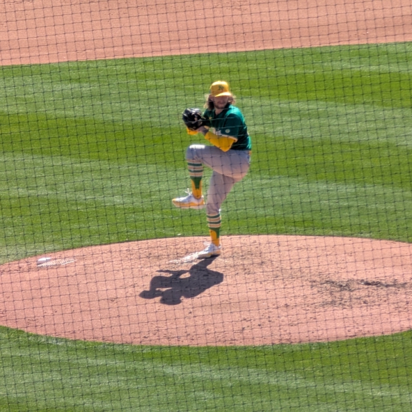 Joey Estes of the Athletics warming up before the fourth inning against the Dodgers