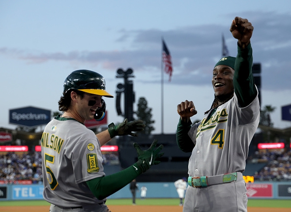 Jacob Wilson and Lawrence Butler of the Athletics celebrate Jacob's homer against the Dodgers