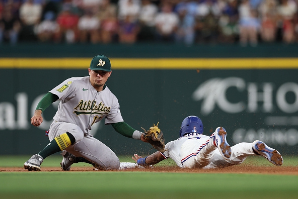 Marcus Semien of the Rangers stealing second against the Athletics