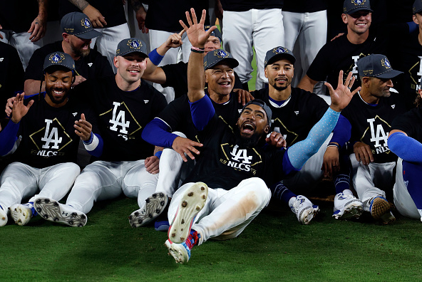 Members of the Dodgers celebrate on the field after eliminating the Phillies from the 2025 NLDS