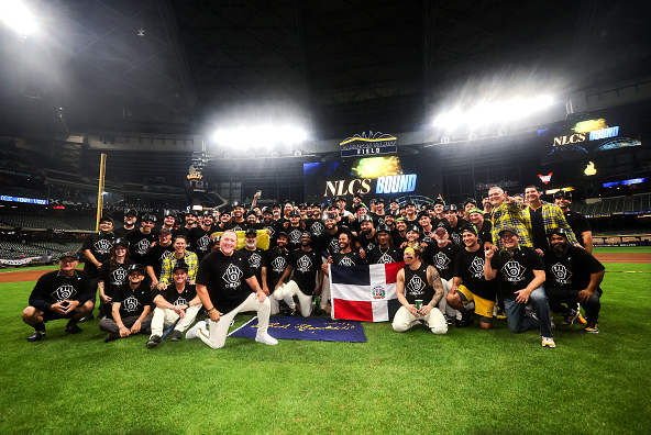 The Brewers pose for a team photo on the field after defeating and eliminating the Cubs in Game 5 of the 2025 NLDS