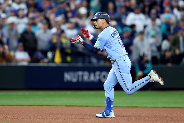 Andres Gimenez of the Blue Jays running out a home run against the Mariners in Game Four of the 2025 ALCS in Seattle.