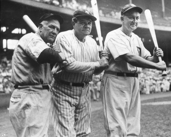 Tris Speaker, Babe Ruth, and Ty Cobb pose together while holding bats in 1941. All three are among the 27 members in the .300/.400/.500 Club, an elite group whose members are almost all in the Hall of Fame.