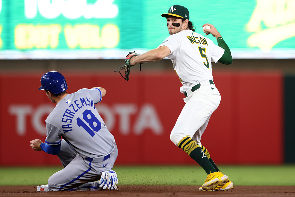 Jacob Wilson of the Athletics turning a double play