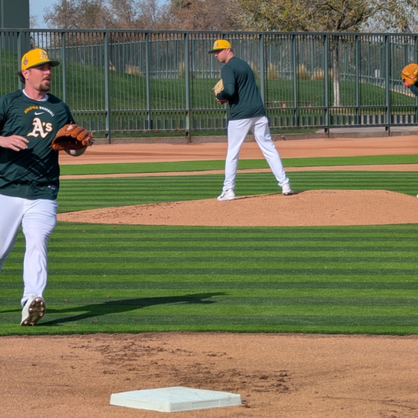 Athletics reliever Mark Leiter Jr. covering first base in pitcher fielding drills during spring training