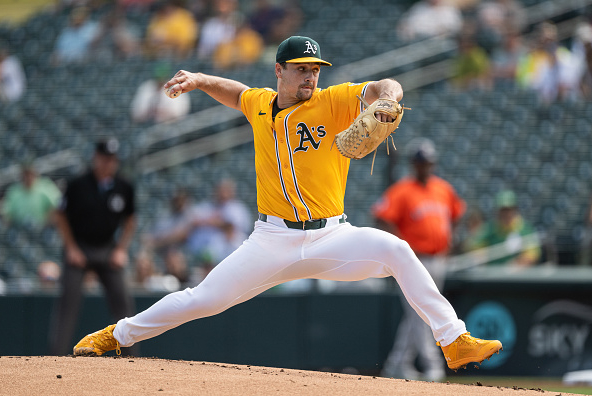 Athletics right-hander J.T. Ginn throwing a pitch.