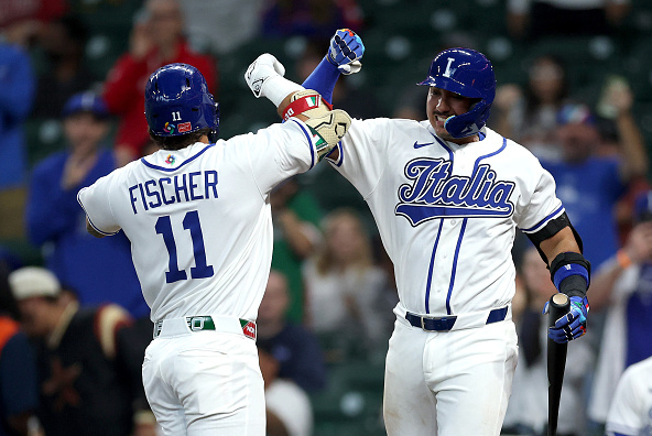 Andrew Fischer and J.J. d'Orazio of Team Italy celebrating a home run in their team's victory over Great Britain in the World Baseball Classic