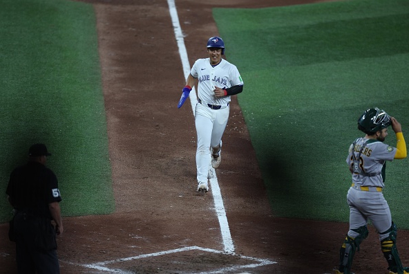Kazuma Okamoto scoring the winning run for the Blue Jays against the Athletics on Opening Day 2026