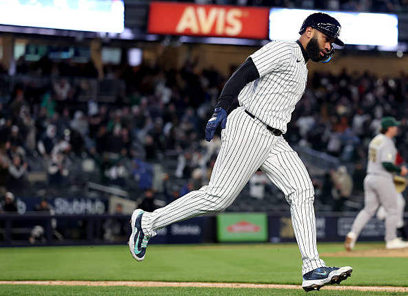 Amed Rosario of the Yankees celebrating a go-ahead homer against the Athletics